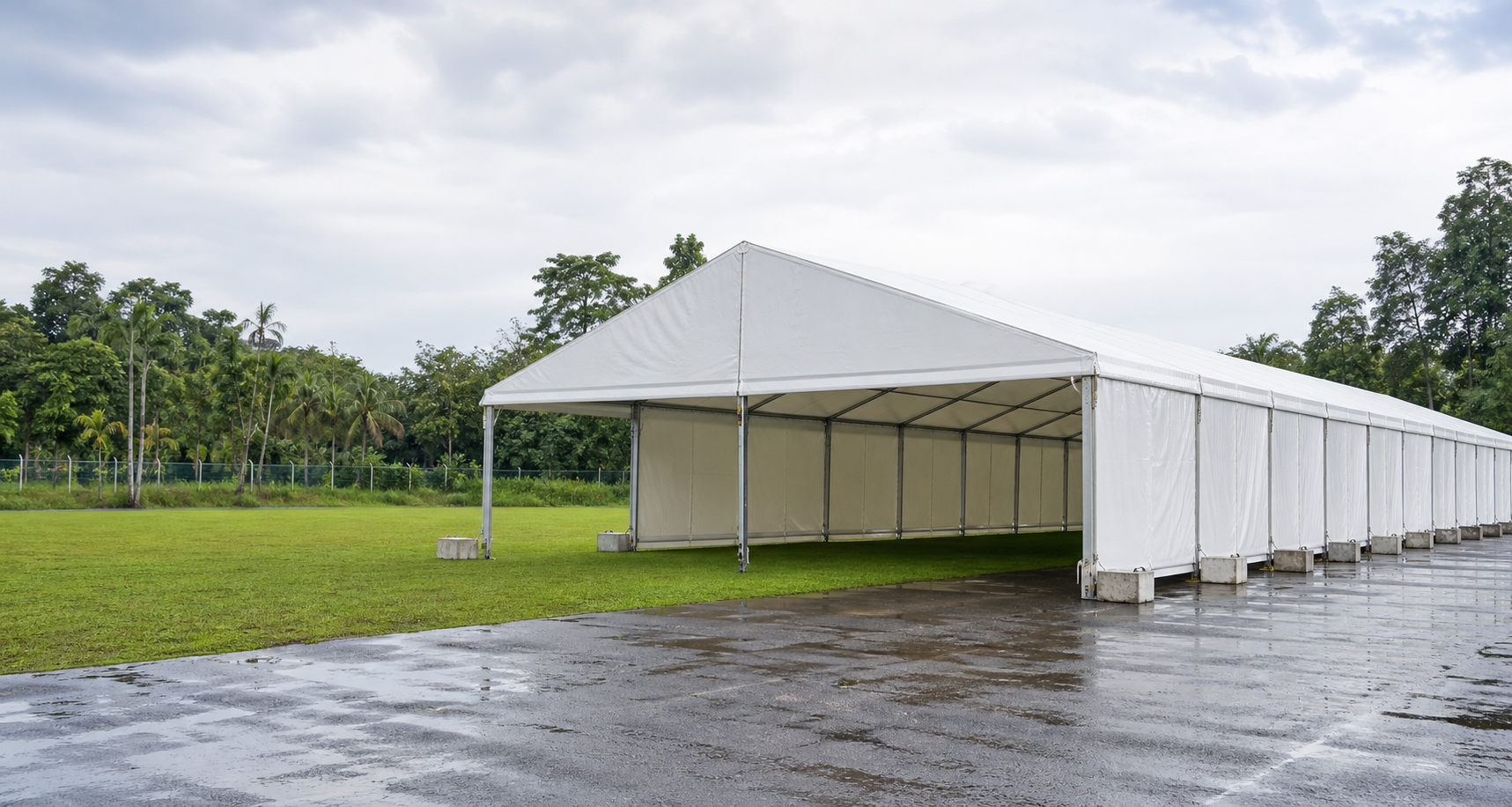 Marquee rental hero view with decorated tent, event lighting, covered guest area and premium setup reference
